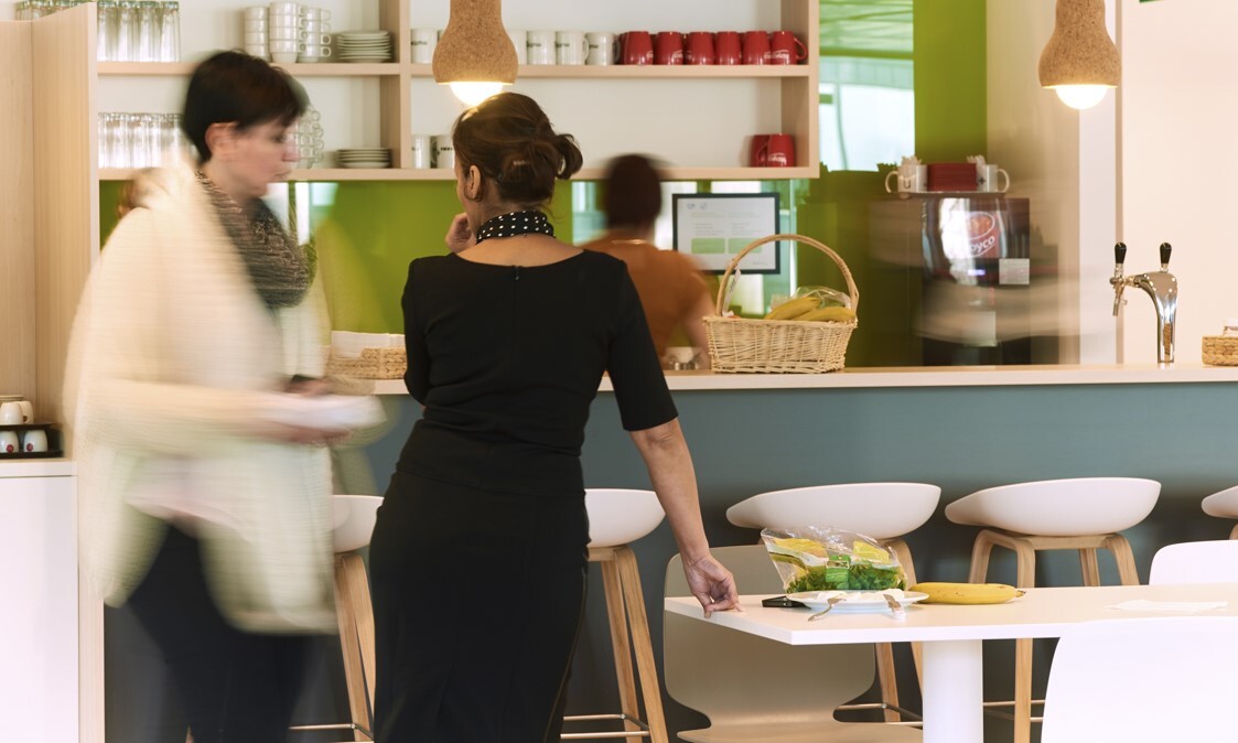 2 women that are taking a break in the cafetaria